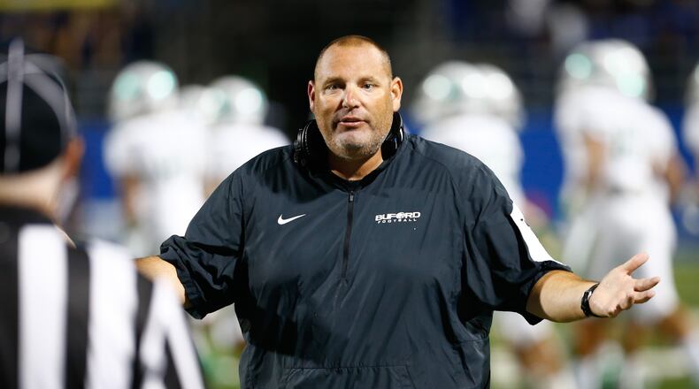 Buford head coach Jess Simpson argues with a referee during the second half against McEachern at Walter H. Cantrell Stadium in Powder Springs, Ga. on Friday, Sept. 4, 2015. McEachern won 37-14. Photo by Kevin D. Liles for the AJC