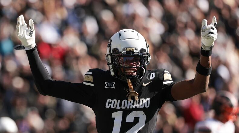 Colorado's Travis Hunter (12) celebrates a touchdown during the third quarter against Oklahoma State at Folsom Field on Nov. 29, 2024, in Boulder, Colorado. (Andrew Wevers/Getty Images/TNS)