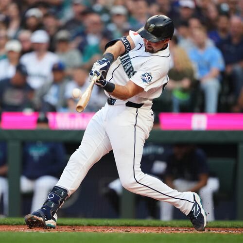 Seattle Mariners' Cal Raleigh hits a two-run home run against the Philadelphia Phillies during the first inning of a baseball game, Monday, Aug. 24, 2026, in Seattle. (AP Photo/Lindsey Wasson)