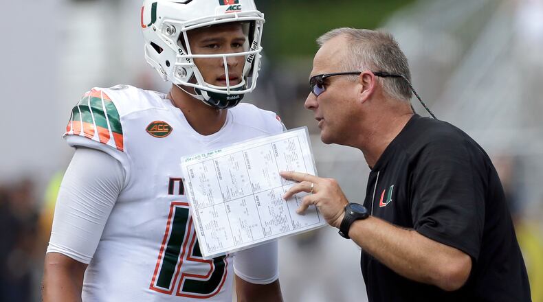 Miami head coach Mark Richt, right, talks with quarterback Brad Kaaya (15) during the second half of an NCAA college football game against Appalachian State in Boone, N.C., Saturday, Sept. 17, 2016. (AP Photo/Chuck Burton)