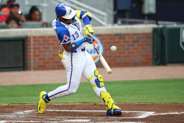 Atlanta Braves' Ronald Acuña Jr. (13) hits a single in the first inning of a baseball game against the Philadelphia Phillies, Saturday, June 28, 2025, in Atlanta. (AP Photo/Colin Hubbard)