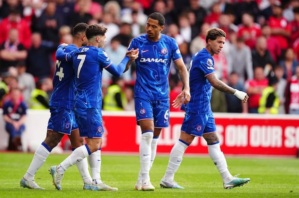Chelsea's Levi Colwill, centre right, celebrates scoring the opening goal during the Premier League match at the City Ground, Nottingham, England, Sunday May 25, 2025. (Mike Egerton/PA via AP)