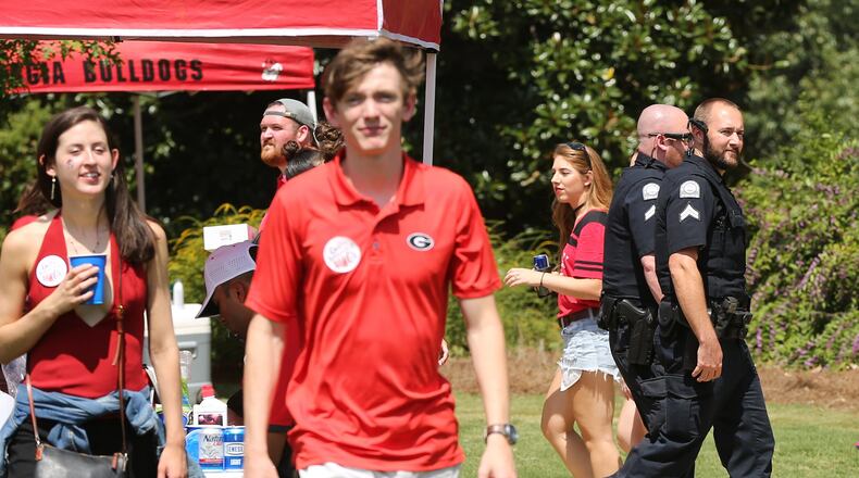 Campus police at the University of Georgia said they had seen no handguns and didn’t expect any trouble while keeping an eye on tailgaters at Myers Quad before Georgia plays Appalachian State on Saturday, September 2, 2017, in Athens. Curtis Compton/ccompton@ajc.com