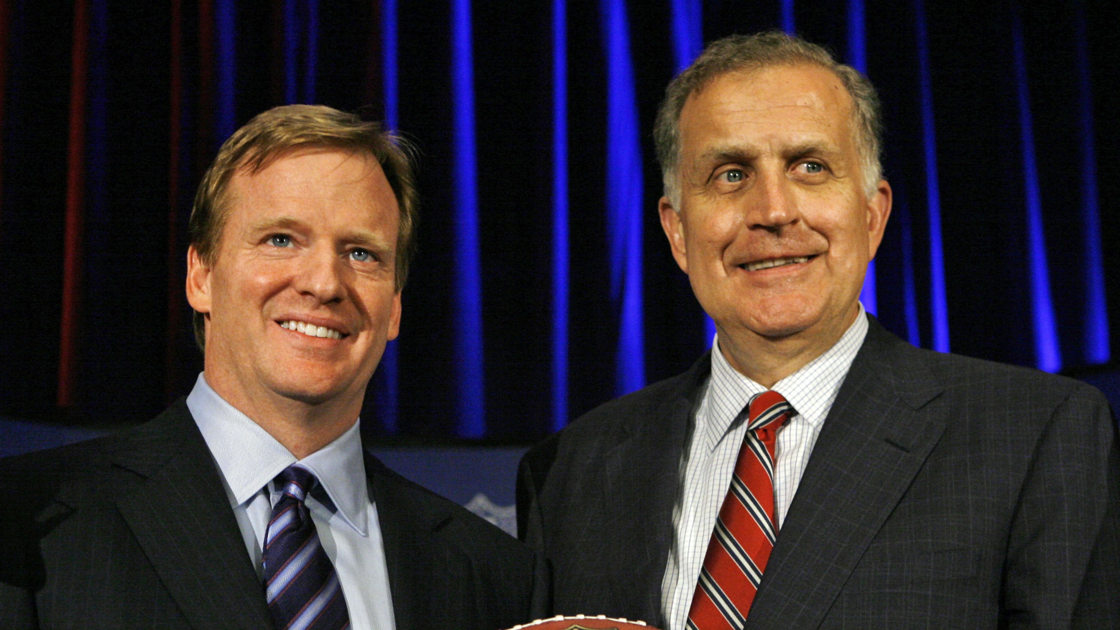FILE - In this Aug. 8, 2006 file photo, Roger Goodell, left, the NFL's chief operating officer, and Paul Tagliabue, NFL commissioner, pose for photos after Goodell was selected to succeed Tagliabue as the league's new commissioner at an NFL meeting in Northbrook, Ill. AP Photo/M. Spencer Green, File)
