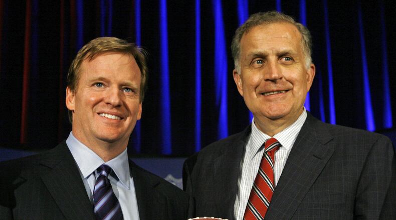 FILE - In this Aug. 8, 2006 file photo, Roger Goodell, left, the NFL's chief operating officer, and Paul Tagliabue, NFL commissioner, pose for photos after Goodell was selected to succeed Tagliabue as the league's new commissioner at an NFL meeting in Northbrook, Ill. AP Photo/M. Spencer Green, File)