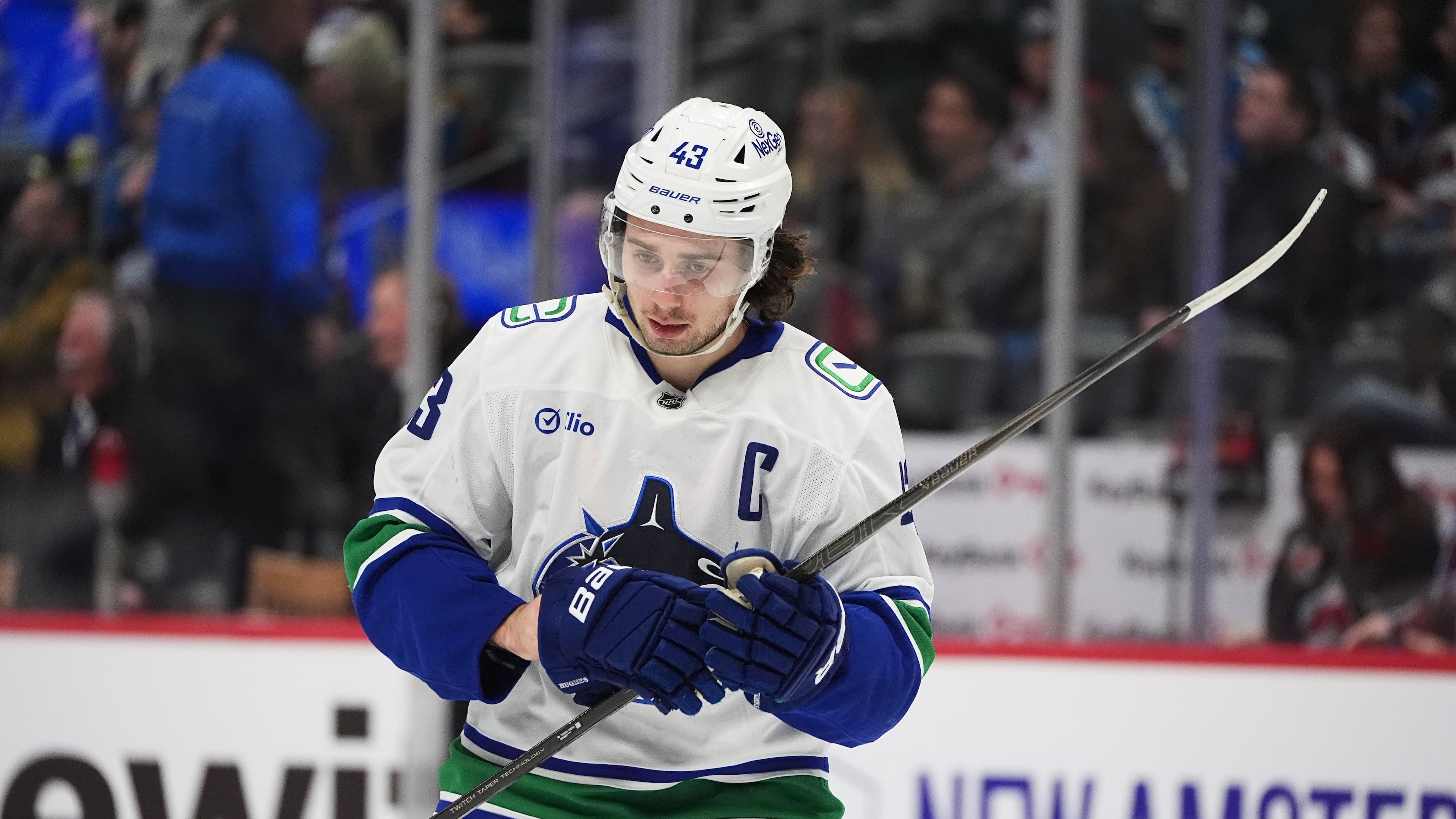 Vancouver Canucks defenseman Quinn Hughes waits for play to begin in the third period of an NHL hockey game against the Colorado Avalanche Tuesday, Dec. 2, 2025, in Denver. (AP Photo/David Zalubowski)