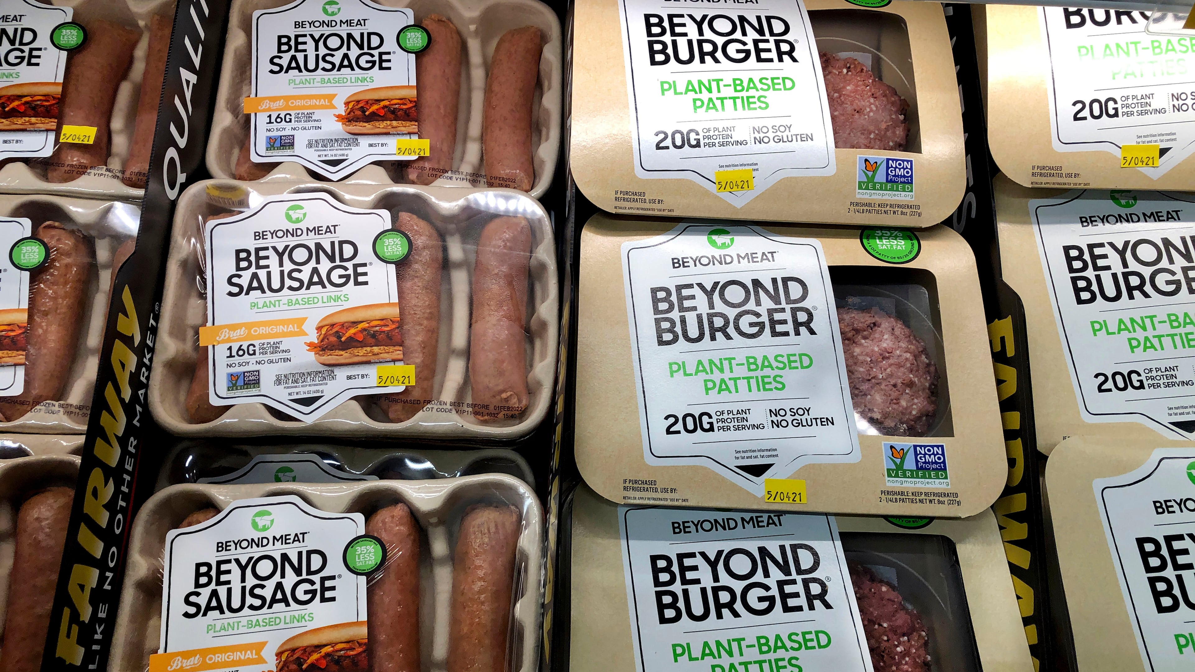 FILE - Packages of Beyond Meat's Beyond Burgers and Beyond Sausage, are shown in this photo, in New York, April 29, 2021. (AP Photo/Richard Drew, File)
