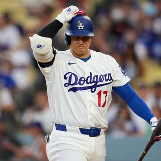 Los Angeles Dodgers' Shohei Ohtani walks back to the dugout after striking out as during the third inning of a baseball game against the Cincinnati Reds, Monday, Sept. 7, 2026, in Los Angeles. (AP Photo/Mark J. Terrill)