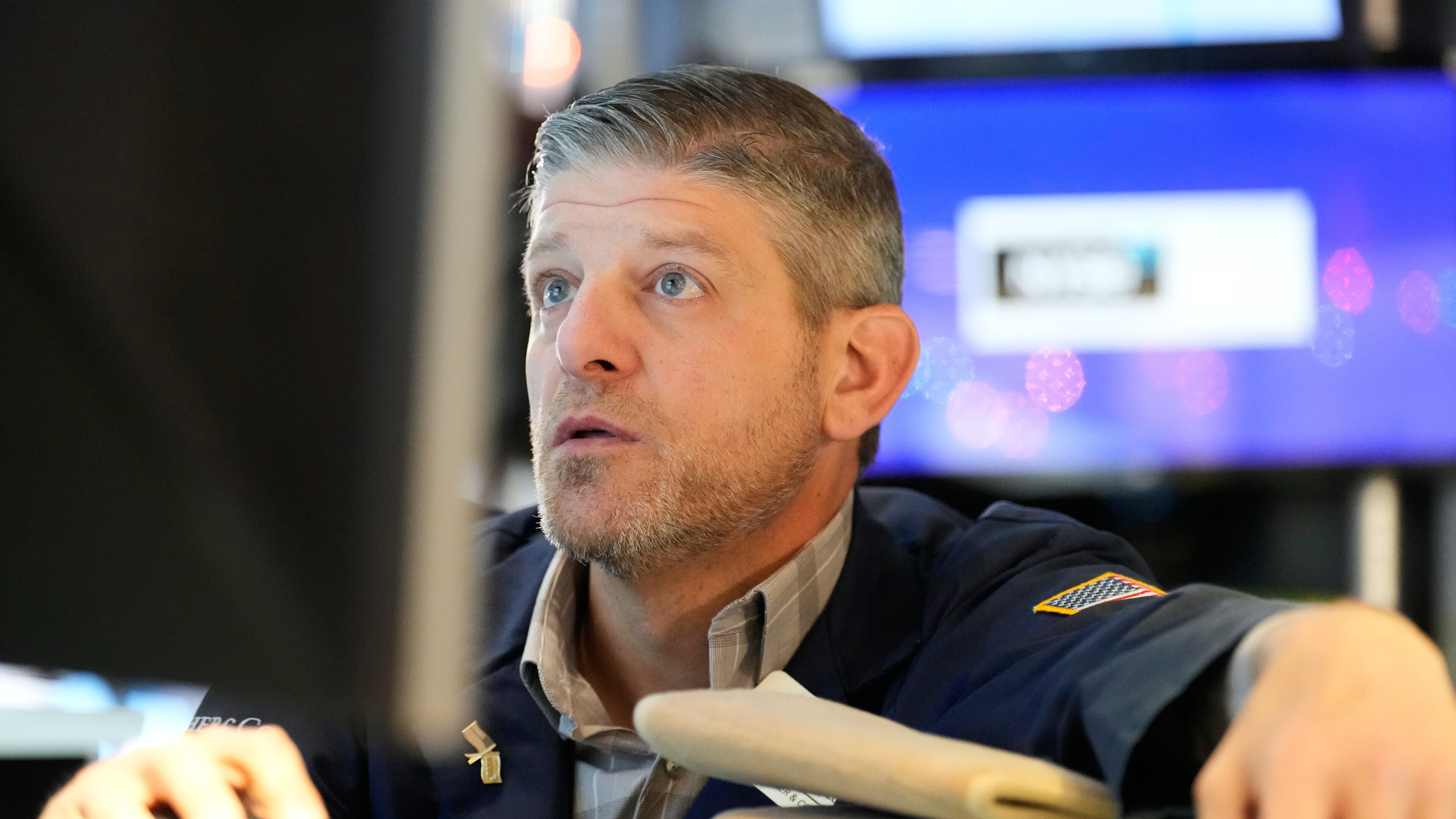 Michael Gallucci works on the floor at the New York Stock Exchange in New York, Wednesday, Dec. 10, 2025. (AP Photo/Seth Wenig)