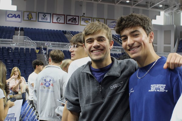 Twin brothers Chase Herzog, left, and Derek Herzog attend rehearsal for Plainview-Old Bethpage John F. Kennedy High School's graduation ceremony at Hofstra University in Hempstead, N.Y., on Tuesday, June 17, 2025. (AP Photo/Philip Marcelo)