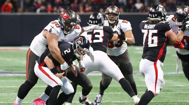 120521 Atlanta: Buccaneers Vita Vea sacks Falcons quarterback Matt Ryan during the second quarter for a loss in a NFL football game on Sunday, Dec 5, 2021, in Atlanta. “Curtis Compton / Curtis.Compton@ajc.com”`