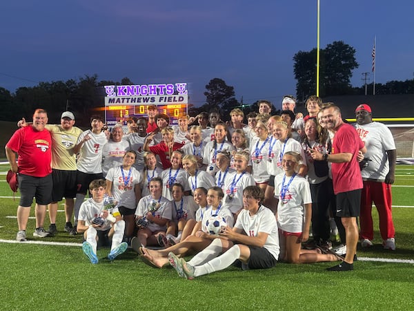 Thomasville's boys and girls soccer teams pose after both clinching 1-0 wins in the Class A Division I state championship on Thursday, May 14, at Matthews Field in Thomaston, Georgia. (Jack Leo/AJC)