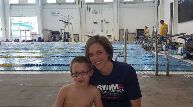 Jonas Warta with his mother Mary Ellen Warta before swim practice at the Cumming Aquatic Center. Jonas is a member of the Chattahoochee Gold Swim Team. Contributed
