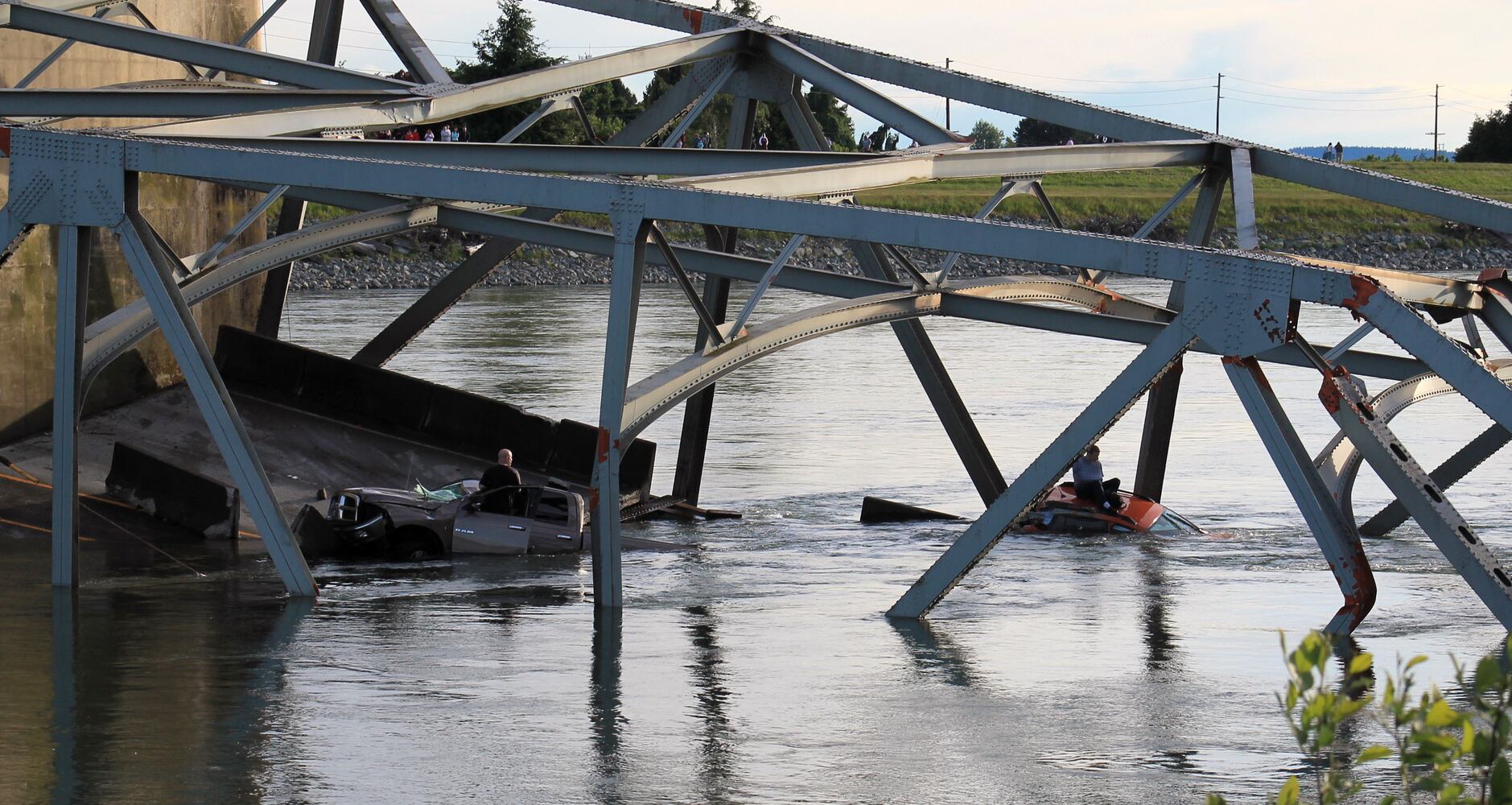 Vehicles, people dumped into water