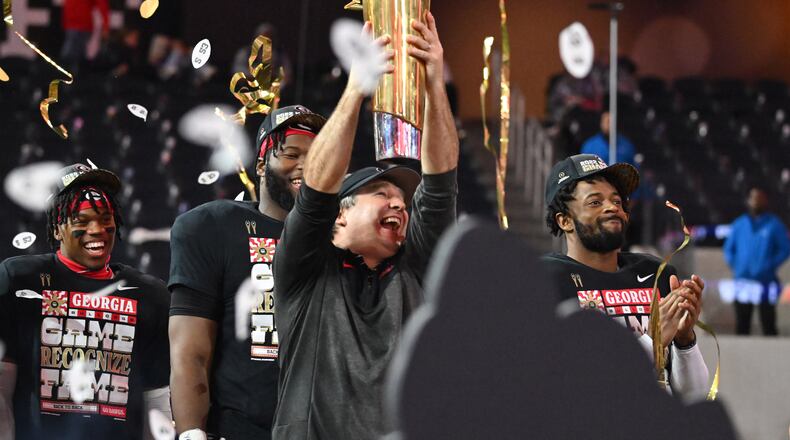 Georgia's head coach Kirby Smart holds up the National Championship Trophy during the 2023 College Football Playoff National Championship game at SoFi Stadium, Monday, Jan. 9, 2023, in Inglewood, California. (Hyosub Shin / Hyosub.Shin@ajc.com)