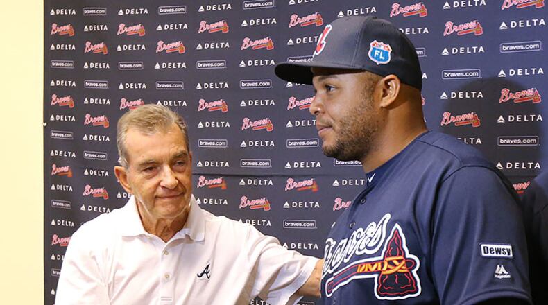 Braves President John Schuerholz and former outfielder Andruw Jones shake hands at the conclusion of a press conference announcing the two will be inducted into the Braves Hall of Fame later this summer.