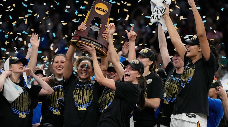 UCLA players celebrate after defeating South Carolina in the women's National Championship Final Four NCAA college basketball tournament game, Sunday, April 5, 2026, in Phoenix. (AP Photo/Ross D. Franklin)