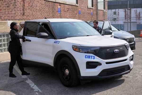 Crisis Intervention Response Team (CIRT) members Therapist Krystian Gardner, left, and Philadelphia Police Officer Vanity Cordero prepare to go out on calls in Philadelphia, Friday, March 14, 2025. (AP Photo/Matt Rourke)