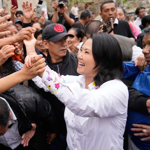 Presidential candidate Keiko Fujimori, of the Popular Force party, greets supporters before voting in the presidential runoff election in Lima, Peru, Sunday, June 7, 2026. (AP Photo/Martin Mejia)