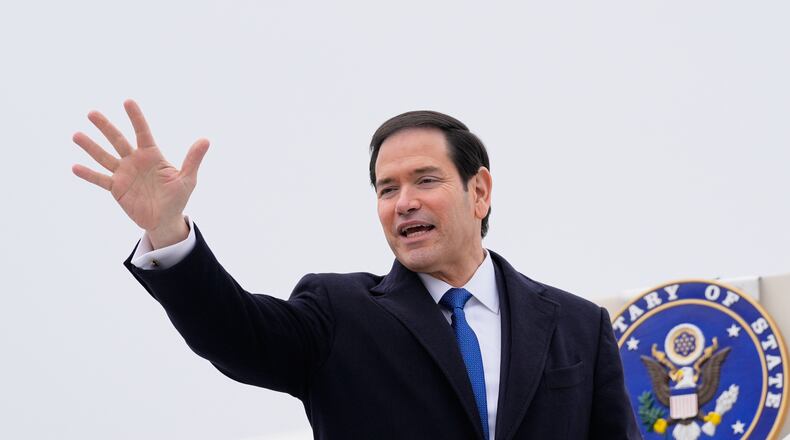 U.S. Secretary of State Marco Rubio waves as he departs at the Liszt Ferenc International Airport in Budapest, Hungary, Monday, Feb. 16, 2026. (AP Photo/Alex Brandon, Pool)