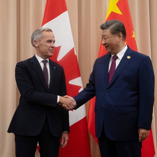 FILE - Canadian Prime Minister Mark Carney, left, shakes hands with Chinese President Xi Jinping at the start of a meeting in Gyeongju, South Korea, Oct. 31, 2025. (Adrian Wyld/The Canadian Press via AP, File)