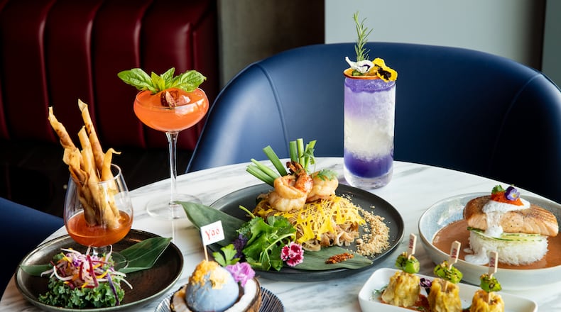 Yao, an upscale Thai-Chinese restaurant and bar, just opened in Dunwoody. Shown here are Taro Rolls (clockwise, from left), Ms. Yao cocktail, Jumbo Prawn Pad Thai, Mr. Yao cocktail, Salmon Panang, Yao Dumplings and Yao's Ice Cream. (Mia Yakel for The Atlanta Journal-Constitution)