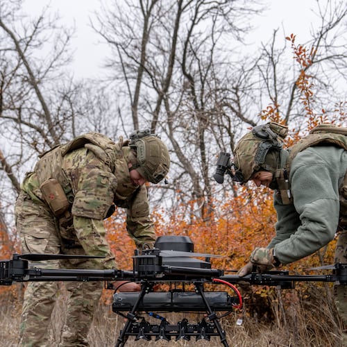 Ukrainian soldiers with the Kraken 1654 unit prepare a Vampire drone before a demonstration for The Associated Press, Wednesday, Nov. 5, 2025, in Kharkiv Oblast, Ukraine. (AP Photo/Julia Demaree Nikhinson)