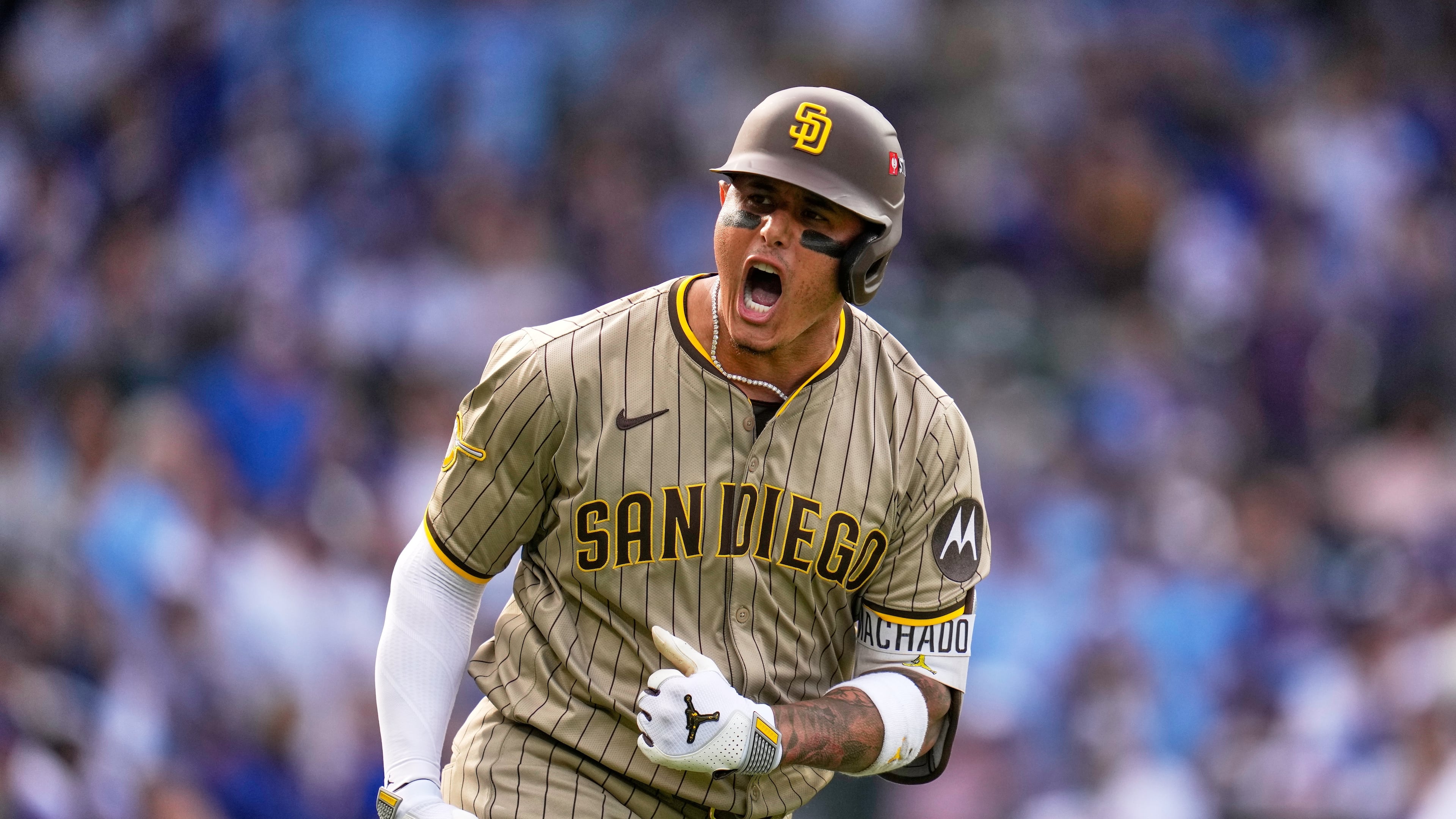 San Diego Padres' Manny Machado is reacts after hitting a two-run home run during the fifth inning of Game 2 of a National League wild card baseball game Wednesday, Oct. 1, 2025, in Chicago. (AP Photo/Erin Hooley)