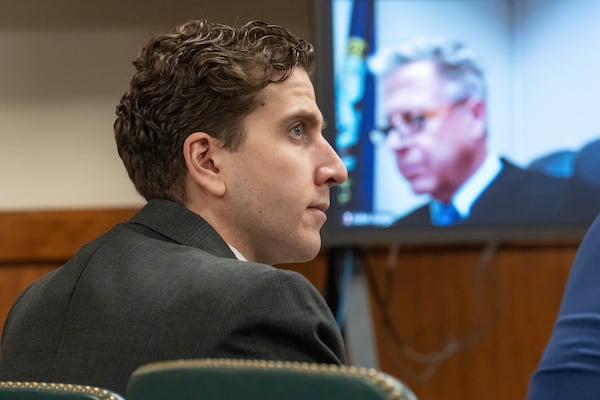 FILE - Bryan Kohberger, left, who is accused of killing four University of Idaho students in November 2022, appears at a hearing in Latah County District Court, Sept. 13, 2023, in Moscow, Idaho, as Second District Judge John C. Judge, seen on a video display, presides over the hearing. (AP Photo/Ted S. Warren, Pool, File)