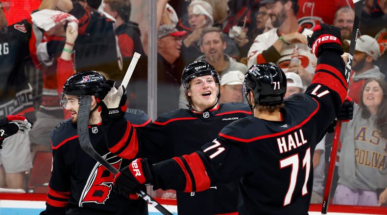 Carolina Hurricanes' Jackson Blake (53) celebrates his goal with teammate Taylor Hall (71) during the second period in Game 5 of the Eastern Conference finals NHL hockey Stanley Cup playoff series against the Montreal Canadiens in Raleigh, N.C., Friday, May 29, 2026. (AP Photo/Karl DeBlaker)