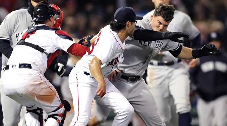 Yankees' Tyler Austin fights the Red Sox's Joe Kelly after being struck by a pitch Kelly threw during the seventh inning Wednesday, April 11, 2018, at Fenway Park in Boston.