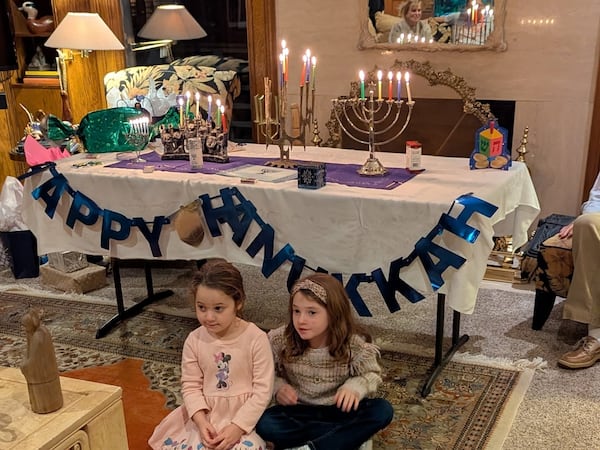 Cylia Bagen and Eloise Bagen, grandchildren of Laury and Terry Bagen, enjoy Hanukkah celebrations. Though Hanukkah is considered a minor festival in the Jewish religious calendar, it carries significant cultural and emotional weight. (Courtesy)