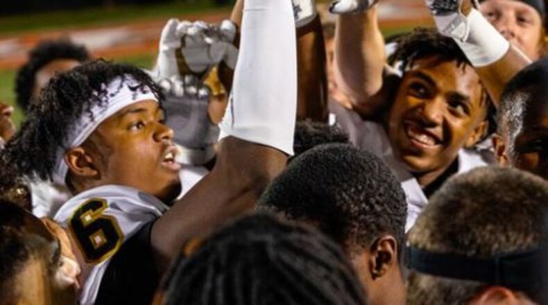 Kodee Brewer of Carrollton celebrates a big win over Kell.