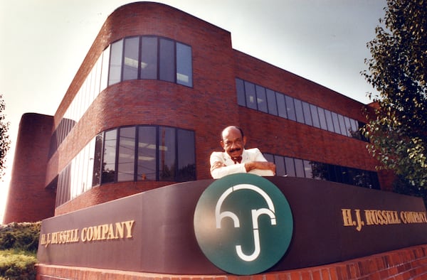 Herman J. Russell, shown here outside his office complex at the corner of Northside Drive and Fair Street in 1990, was a prominent business man who left his mark on the Atlanta skyline. (AJC File)