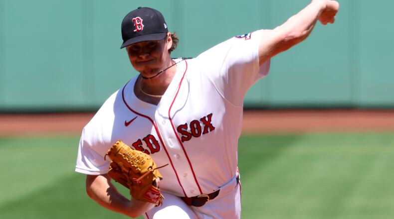Boston Red Sox pitcher Jake Bennett throws during the first inning of the first baseball game of a doubleheader against the Tampa Bay Rays, Friday, July 17, 2026, in Boston. (AP Photo/Mark Stockwell)
