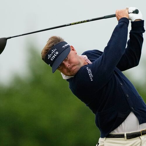 Keith Mitchell watches his tee shot on the 13th hole during the first round of the U.S. Open golf tournament at Shinnecock Hills Golf Club in Southampton, N.Y., Thursday, June 18, 2026.(AP Photo/Gerald Herbert)
