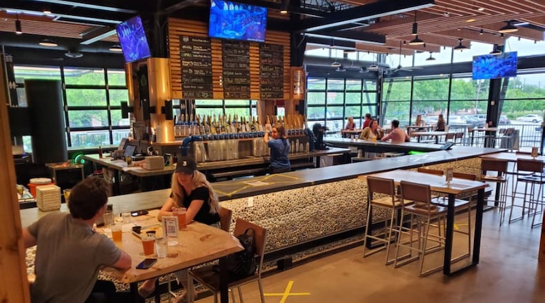 Atlanta’s SweetWater Brewing recently reopened its reconfigured taproom with full-service beer and food available indoors and outdoors. Beer and food are available to go, as well. Courtesy of Sweetwater Brewing Co.