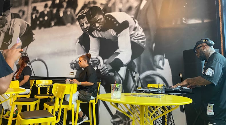A mural of cyclist Major Taylor covers a wall inside the Handlebar. / Courtesy of the Handlebar