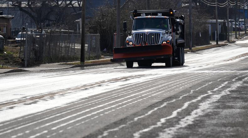 A Nashville Department of Transportation truck applies salt brine to a roadway Thursday, Jan. 22, 2026, in Nashville, Tenn. ahead of a winter storm expected to hit the state over the weekend. (AP Photo/George Walker IV)