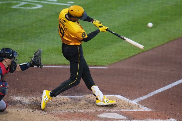 Pittsburgh Pirates' Jared Triolo hits a solo home run off Atlanta Braves pitcher Bryce Elder during the sixth inning of a baseball game in Pittsburgh, Friday, May 9, 2025. (AP Photo/Gene J. Puskar)