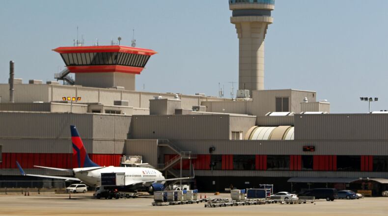 Most fliers at Hartsfield-Jackson pay $9 in Passenger Facility Charges on a nonstop, roundtrip booking. That could rise to $17 under a proposal in Congress. JASON GETZ / JGETZ@AJC.COM