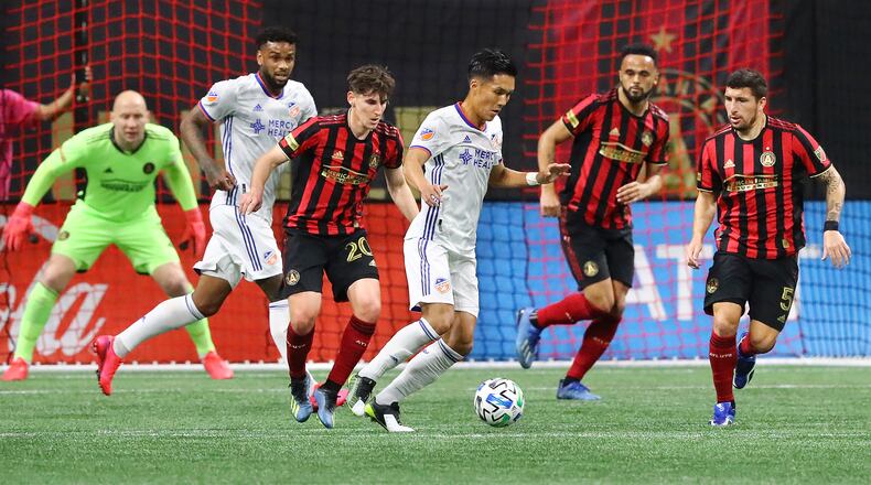 March 8, 2020 Atlanta: Atlanta United goalkeeper Brad Guzan (from left), Emerson Hyndman, Anton Walkes, and Eric Remedi defend against FC Cincinnati during a 2-1 victory in a MLS soccer match on Saturday, March 8, 2020, in Atlanta. Curtis Compton ccompton@ajc.com