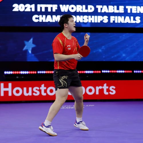 FILE - China's Zhendong Fan reacts after winning match point to take the men's singles finals match during the World Table Tennis Championships Monday, Nov. 29, 2021, in Houston. (AP Photo/Michael Wyke, File)