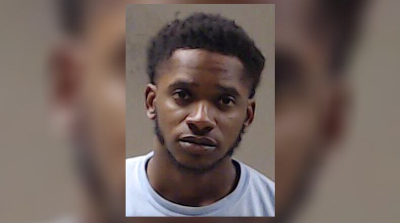 Jadir Woods, 24, was arrested Wednesday and charged with murder after a shooting at a Decatur business, according to police.