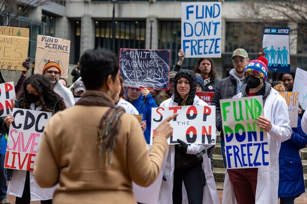 Faculty members and others working at universities rally against the Trump administration's proposed cuts to research funding in front of the Sam Nunn Federal Building in Atlanta on Wednesday, February 19, 2025. (Arvin Temkar / AJC)