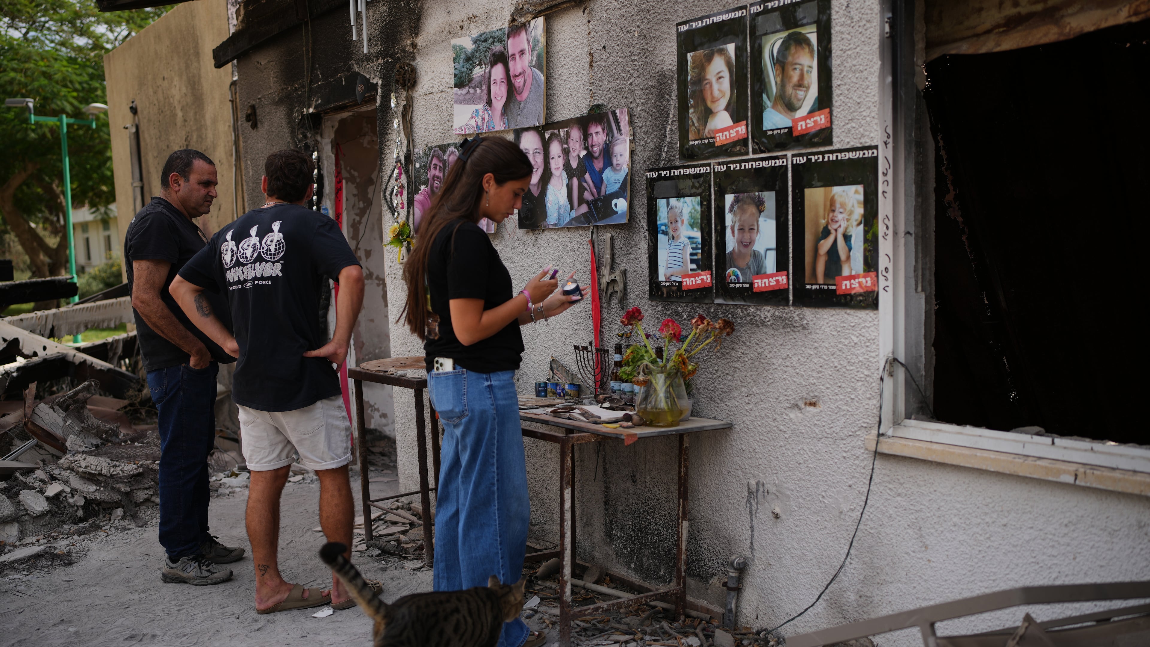 People visit the burnt house of Siman Tov family where all five family members were killed during the Hamas attack on Oct. 7, 2023, in Kibbutz Nir Oz, Israel, a day before Israel marks the two-year anniversary of the attack, Monday, Oct. 6, 2025. (AP Photo/Ohad Zwigenberg)