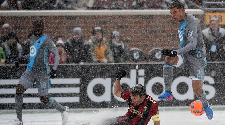 Michael Parkhurst of Atlanta United FC challenges Christian Ramirez of Minnesota United FC for the ball during the first half of the match on March 12, 2017 at TCF Bank Stadium in Minneapolis, Minnesota. (Photo by Hannah Foslien/Getty Images)