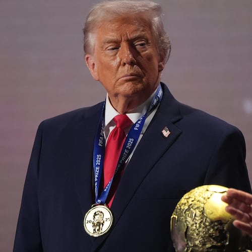 FILE - President Donald Trump stands on stage next to the FIFA World Cup after receiving the FIFA Peace Prize during the draw for the 2026 soccer World Cup at the Kennedy Center in Washington, Dec. 5, 2025. (AP Photo/Jacquelyn Martin, File)