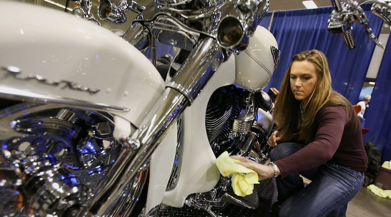 Cindy Connors of Lawrenceville, shines her 2003 Road King Harley before competing in the Stock Custom category during The annual Great American Motorcycle Show held at the North Atlanta Trade Center in Norcross Saturday, January 24, 2009. VINO WONG / vwong@ajc.com