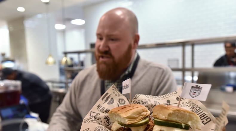 Chef Kevin Gillespie speaks to members of the press as Mercedes- Benz Stadium's food and beverage staff prepares their signature menu items for the Super Bowl LIII between New England Patriots and Los Angeles Rams on Tuesday, January 29, 2019.